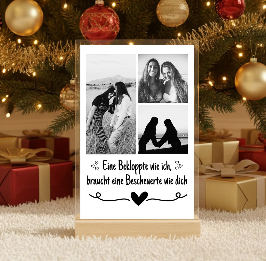 Hyperrealistic photo of an acrylic glass display with a wooden base, sized 20 × 30 cm, featuring the same cartoon-style illustration of the blonde woman and her Labrador as in the referenced image