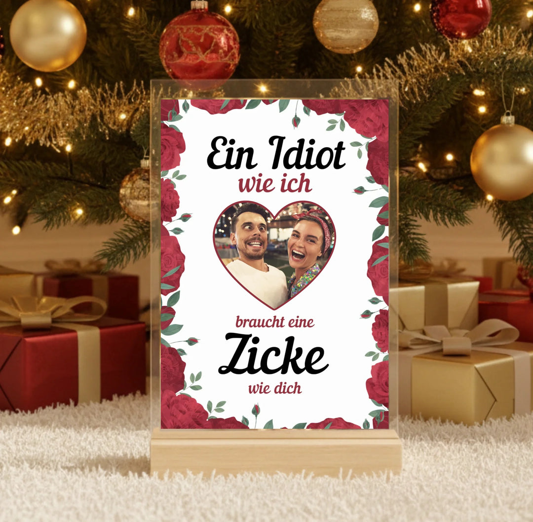 Hyperrealistic photo of an acrylic glass display with a wooden base, sized 20 × 30 cm, featuring the same cartoon-style illustration of the blonde woman and her Labrador as in the referenced image